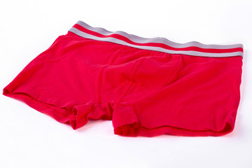 Male pants isolated on white background. Red cotton boxer pants for boy on white background. Men underwear of high quality.