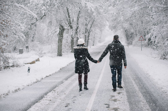 Wedding Couple Walking In The Snow