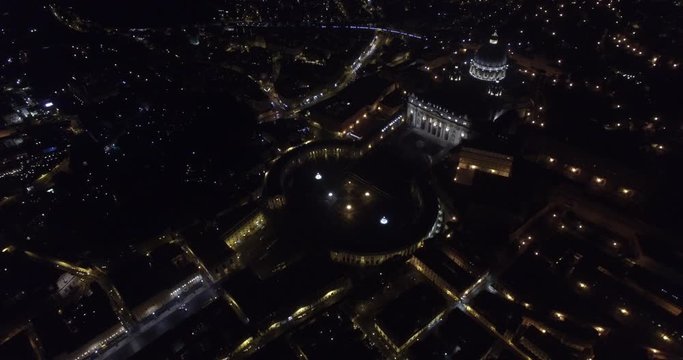ROME, ITALY  &ndash; OCTOBER 2015 : Aerial shot over Vatican City at night with St Peters Basilica and cityscape in view