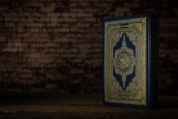 Koran - holy book of Muslims ( public item of all muslims ) on the table , still life