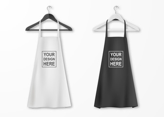 Vector white and black cotton kitchen apron set with clothes hangers closeup isolated on white background. Design template, mock up for branding, advertising etc. Cooking or baker concept
