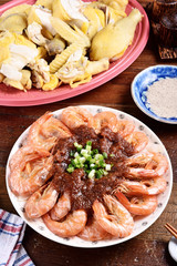 A plate of steamed shrimps with sauce