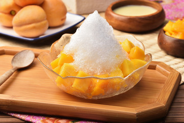 Shaved ice dessert with fresh mango            