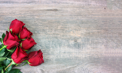 Fototapeta na wymiar Valentine's Day Red Roses Over Wood Background, Horizontal, Copy Space