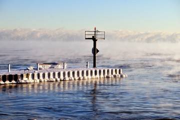 Ice coats a breakwater as vapor rises from the Lake Michigan waters as ice forms in Chicago's 31st...