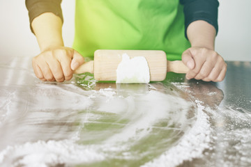 Chef knead dough to prepare food.