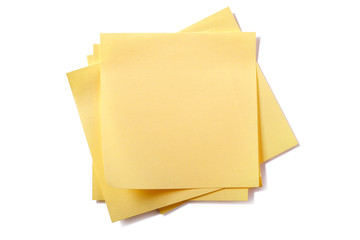 Untidy stack pile heap yellow square sticky post it note isolated on white background photo