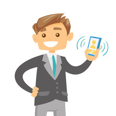 Young caucasian white businessman holding ringing mobile phone in hand. Happy smiling businessman showing a mobile phone with incoming call. Vector cartoon illustration isolated on white background.