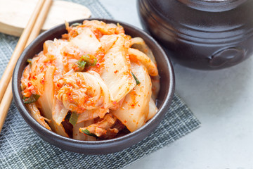 Kimchi cabbage. Korean appetizer in ceramic bowl, horizontal