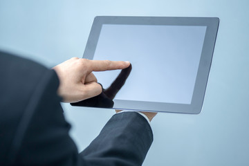 Businessman pressing tablet, technology, internet and networking concept