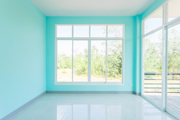 Fototapeta na wymiar Construction Home Empty Room Blue color interior window white aluminum and Door wooden on wall