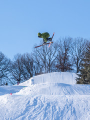People are having fun in downhill skiing and snowboarding