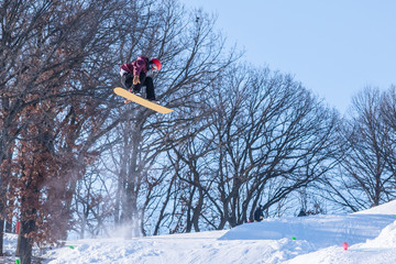 People are having fun in downhill skiing and snowboarding