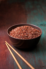 red rice in a ceramic bowl