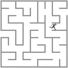 Businessman trying to escape from maze labyrinth