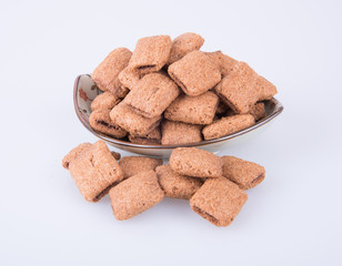 cookie or biscuits filled with chocolate cream on a background.