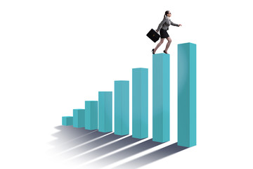 Businesswoman climbing bar chart in economic recovery concept