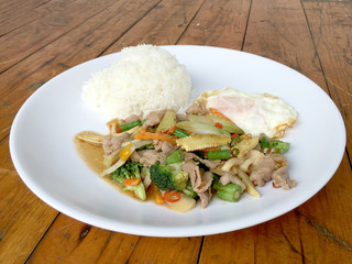 wok fried chicken stir fry chinese vegetables, corn, carrot, broccoli,