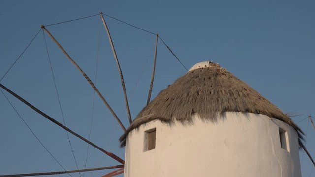 close up of a famous old windmill in chora on mykonos, greece