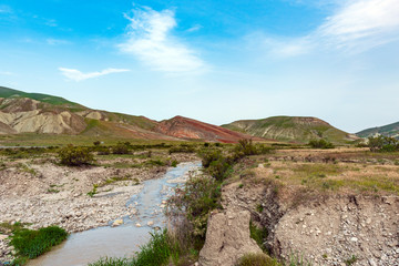 Fototapeta na wymiar River in amazing red mountains