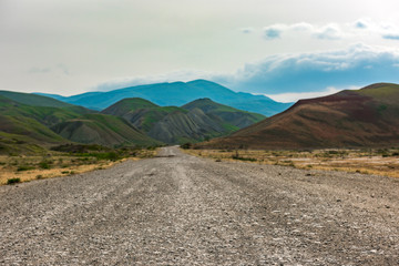 Road to mountains in the valley, mountain landscape