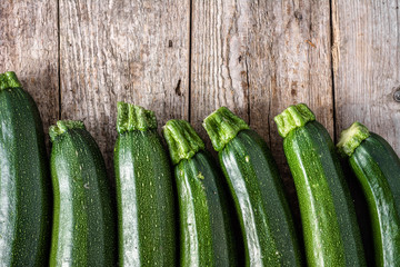 Fresh zucchini, green vegetables, local market organic produce, top view