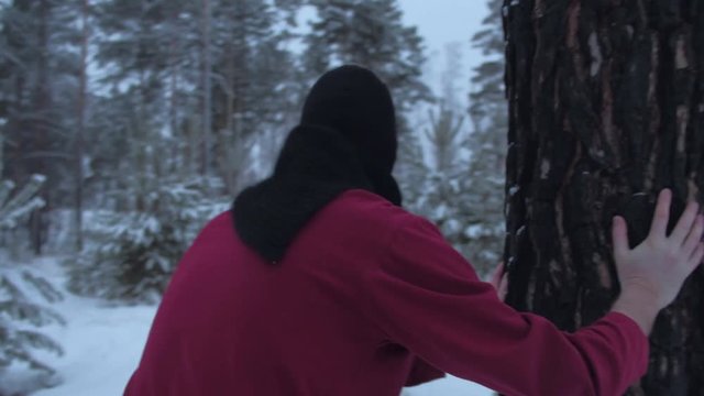 Lost man running through the winter woods trying to find a way out.