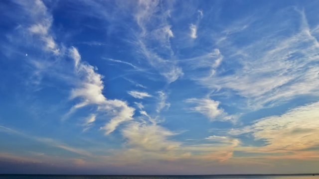 Timelapse of evening cloudy sky over sea