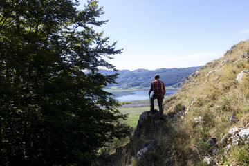 Fototapeta premium hiker on mountain peak and lake matese