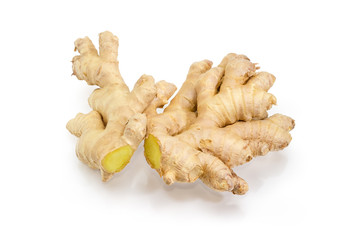 Two ginger roots on a white background