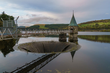 Evening view over the Pontsticill Reservoir near Merthyr Tydfil, Mid Glamorgan, Wales, UK - with the Overflow and the Valve tower