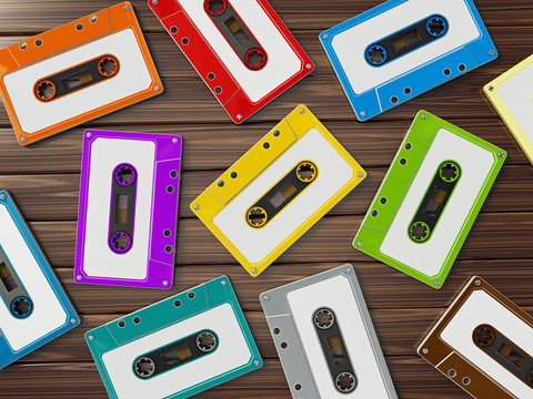 Multi-colored retro audio cassettes on wooden table. 3D illustration
