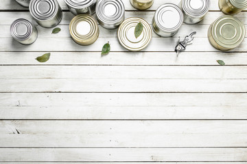 Tin cans with food and opener.