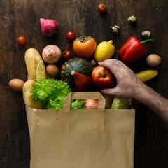 Top view paper bag of different health food