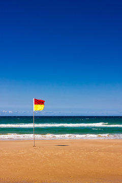 Lonely Life Saver Flag On Australian Beach