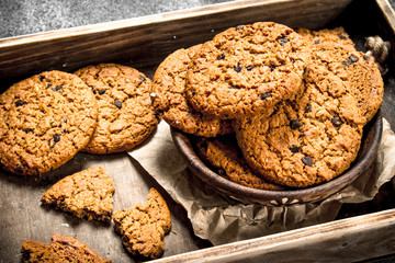Oatmeal cookies with chocolate in a bowl.