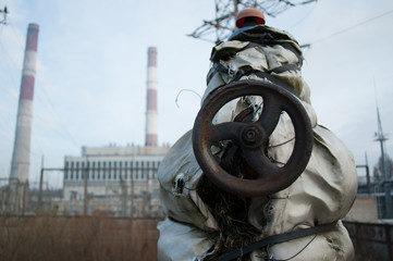 Valve in the front and soviet power plant in the distance.