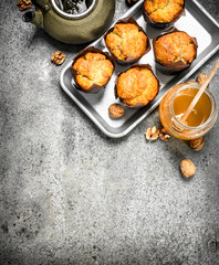 Honey muffins with a teapot.