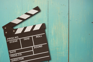 vintage photo of movie clapper on wood