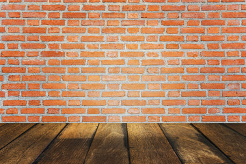 empty room with red brick wall and wooden floor