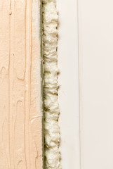 Fixing the gap in the door with construction foam
