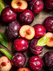 Ripe plums with a wooden box.