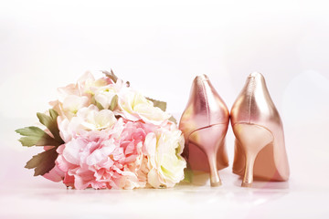 Wedding shoes and bouquets, toned image