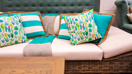 Blue and white cushions on a sofa as styled by interior designer