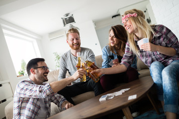 Friends having fun and smiling together indoors