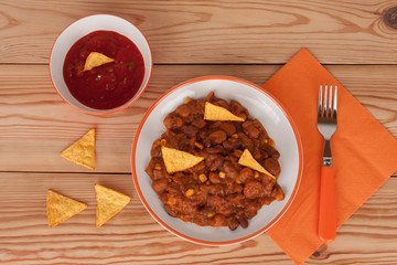 Chili Con Carne with salsa sauce and tortilla chips