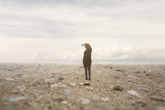 solitary man looks at the infinite in a surreal and spectacular landscape