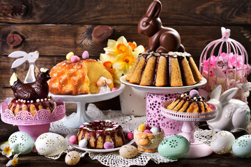 assortment of various ring cakes for easter on festive table