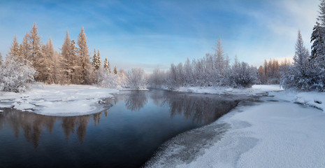 Winter landscape on the ice-free stream in South Yakutia, Russia