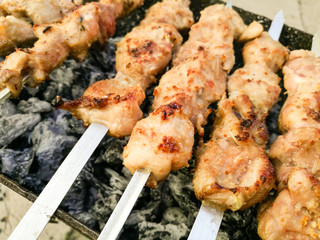 Shish kebab on metal sticks roasted on the grill
